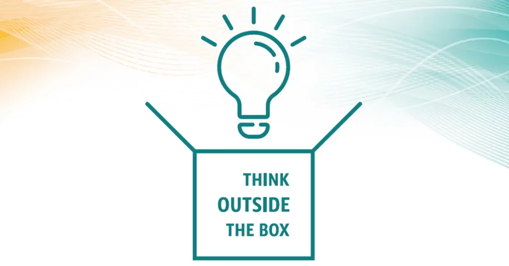 lightbulb above a box with the text "think outside the box"